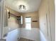 Practical laundry room includes built-in storage and ample counter space at 125 Mcintosh Estates Dr, Sharpsburg, GA 30277