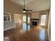 Bright living room features hardwood floors and a decorative fireplace with direct access to the deck at 125 Mcintosh Estates Dr, Sharpsburg, GA 30277