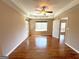 Spacious main bedroom with hardwood floors and natural light at 125 Mcintosh Estates Dr, Sharpsburg, GA 30277