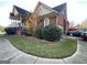 Brick home with a well-manicured lawn, attached garage, and mature shrubs at 239 Overland Trl, Mcdonough, GA 30252