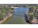 Picturesque lake view featuring a serene waterway with trees and lush greenery at 4852 Jacobs Cove Pt, Buford, GA 30519