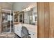 Bathroom with a walk-in shower, dual vanity, and stone floors, and ample counter space at 4852 Jacobs Cove Pt, Buford, GA 30519