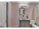 Charming powder room with vessel sink, decorative mirror, and pastel pink walls at 4852 Jacobs Cove Pt, Buford, GA 30519
