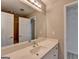 Bathroom featuring a spacious vanity with a sink, a large mirror, and ample storage space at 4852 Jacobs Cove Pt, Buford, GA 30519