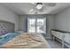 Comfortable bedroom with neutral walls, natural light, and matching nightstand and dresser at 4852 Jacobs Cove Pt, Buford, GA 30519