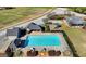 Aerial shot of the community pool with chairs, tables, pool house and a playground at 4852 Jacobs Cove Pt, Buford, GA 30519