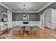 Elegant dining room with hardwood floors, chandelier, and stylish decor at 4852 Jacobs Cove Pt, Buford, GA 30519