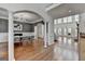 Open floor plan with hardwood floors connecting the dining room and living spaces at 4852 Jacobs Cove Pt, Buford, GA 30519