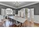 Open dining area showcasing hardwood floors and seamless flow to living spaces at 4852 Jacobs Cove Pt, Buford, GA 30519