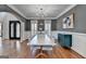 Dining room with hardwood floors, wainscoting, and a large table at 4852 Jacobs Cove Pt, Buford, GA 30519