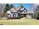 Stunning two-story home with lush landscaping and a well-manicured lawn at 4852 Jacobs Cove Pt, Buford, GA 30519