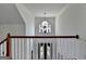 Bright foyer featuring a decorative chandelier and an arched window above the front door at 4852 Jacobs Cove Pt, Buford, GA 30519