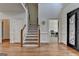 Inviting foyer featuring hardwood floors, staircase, and natural light at 4852 Jacobs Cove Pt, Buford, GA 30519
