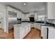 Bright kitchen with white cabinets, stainless steel appliances, and granite countertops at 4852 Jacobs Cove Pt, Buford, GA 30519