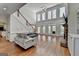 Bright living room with hardwood floors, fireplace, staircase and lots of natural light at 4852 Jacobs Cove Pt, Buford, GA 30519