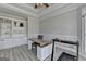 Well-lit office featuring a built-in bookcase, modern desk, and neutral color palette at 4852 Jacobs Cove Pt, Buford, GA 30519