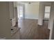 Spacious dining room area with hardwood flooring, large window with trim, and neutral paint at 1126 Old Jackson Rd, Locust Grove, GA 30248