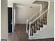 Inviting foyer with staircase and hardwood flooring, creating a warm and welcoming entrance at 1126 Old Jackson Rd, Locust Grove, GA 30248