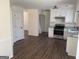 Bright open kitchen with white cabinets, stainless steel appliances, and plenty of counter space at 1126 Old Jackson Rd, Locust Grove, GA 30248