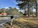 Charming view of the street with a mailbox and mature trees lining the roadway at 1126 Old Jackson Rd, Locust Grove, GA 30248