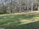 Expansive green yard featuring mature trees, and a tranquil setting at 1126 Old Jackson Rd, Locust Grove, GA 30248