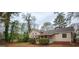 Exterior of home showcasing backyard space with mature landscaping and cozy porch at 35 East Honeysuckle Ln, Carrollton, GA 30116