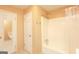 A bathroom featuring two doorways and a tub/shower combo with a shower curtain at 35 East Honeysuckle Ln, Carrollton, GA 30116
