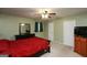 Comfortable bedroom with neutral carpet, ceiling fan and an adjacent doorway at 35 East Honeysuckle Ln, Carrollton, GA 30116