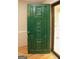 View of the front door with unique carved flower designs and vintage green paint at 35 East Honeysuckle Ln, Carrollton, GA 30116