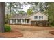 Charming single-Gathering home featuring a cozy front porch and well-maintained landscaping at 35 East Honeysuckle Ln, Carrollton, GA 30116
