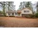 Traditional two-story home boasts great curb appeal with nice landscaping at 35 East Honeysuckle Ln, Carrollton, GA 30116