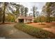 Cozy home with an attached garage surrounded by beautiful mature trees at 35 East Honeysuckle Ln, Carrollton, GA 30116
