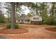 Charming single-Gathering home featuring a cozy front porch and well-maintained landscaping at 35 East Honeysuckle Ln, Carrollton, GA 30116