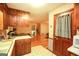 Kitchen featuring vintage wood cabinets with white countertops, stainless steel appliances, and breakfast nook at 35 East Honeysuckle Ln, Carrollton, GA 30116