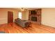 Inviting living room with wood floors, exposed brick fireplace, and contemporary furnishings at 35 East Honeysuckle Ln, Carrollton, GA 30116