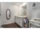 Bright bathroom featuring a dual sink vanity and modern fixtures at 1310 Rogers Trce, Lithonia, GA 30058