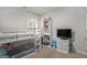 Bright bedroom featuring a bunk bed, shelving, and carpeted floor at 1310 Rogers Trce, Lithonia, GA 30058