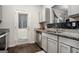 Modern kitchen featuring stainless steel appliances, granite countertops, and ample cabinet space at 1310 Rogers Trce, Lithonia, GA 30058