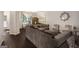 Comfortable living room featuring hardwood floors, stylish seating, and abundant natural light at 1310 Rogers Trce, Lithonia, GA 30058