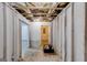 Unfinished basement space with exposed ceiling, framing, and doorway at 217 Old Carrollton Rd, Carrollton, GA 30116