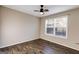 Bedroom featuring hardwood floors, a ceiling fan, and natural light at 217 Old Carrollton Rd, Carrollton, GA 30116