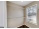 Walk-in closet with white wire shelving and a window for natural light at 217 Old Carrollton Rd, Carrollton, GA 30116