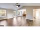 Spacious living room with hardwood floors, fireplace, vaulted ceiling, and large windows for ample natural light at 217 Old Carrollton Rd, Carrollton, GA 30116