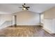 Open-concept living room featuring a vaulted ceiling, fireplace, and wood floors at 217 Old Carrollton Rd, Carrollton, GA 30116