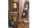 Water heater and HVAC system in utility area at 217 Old Carrollton Rd, Carrollton, GA 30116
