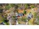 Aerial view of a property with lush trees, a house, outbuilding, and a long driveway at 275 Cedars Glen Cir, Villa Rica, GA 30180