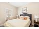 Cozy bedroom with large window, crib, soft lighting, and comfortable furnishings at 275 Cedars Glen Cir, Villa Rica, GA 30180