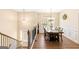 Bright dining room with wood floors, chandelier, and large windows at 275 Cedars Glen Cir, Villa Rica, GA 30180