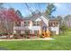 Charming two-story home with white siding, wood shutters, stone accents, and a well-manicured lawn at 275 Cedars Glen Cir, Villa Rica, GA 30180