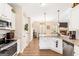 Well-lit kitchen with white cabinets, granite countertops, and stainless steel appliances at 275 Cedars Glen Cir, Villa Rica, GA 30180